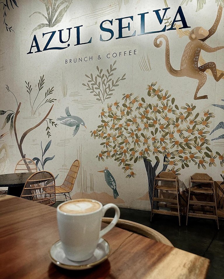 Azul Selva botanical mural inside the cafe