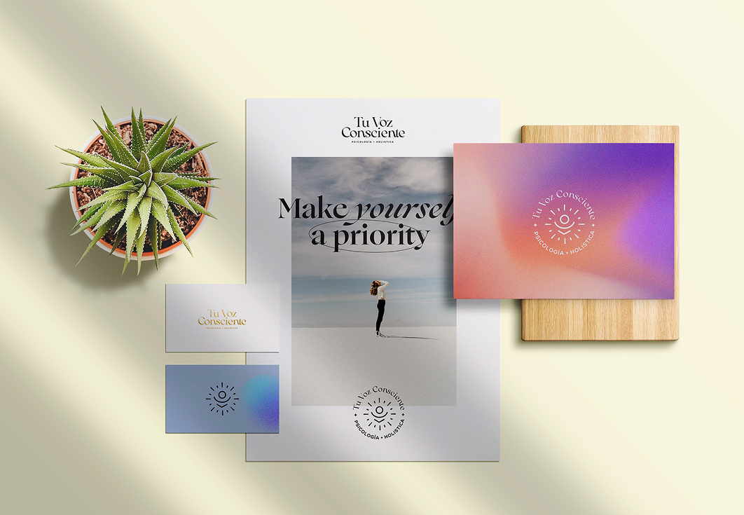 Tu Voz Consciente flatlay with a plant, poster, and branded card